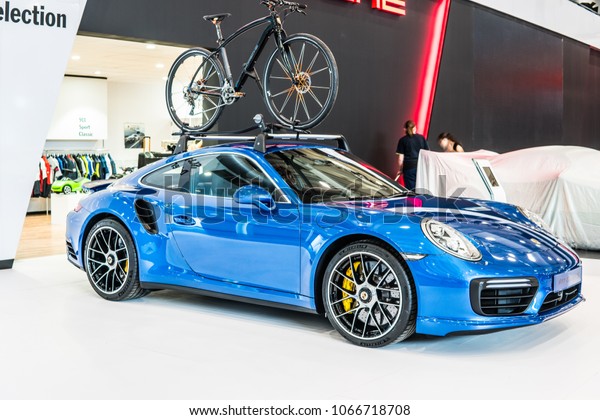 Poznan, Poland,\
April 05, 2018: metallic blue Porsche 911 Turbo S at Poznan\
International Motor Show, high performance rear-engined classic\
German sports car made by Porsche\
AG