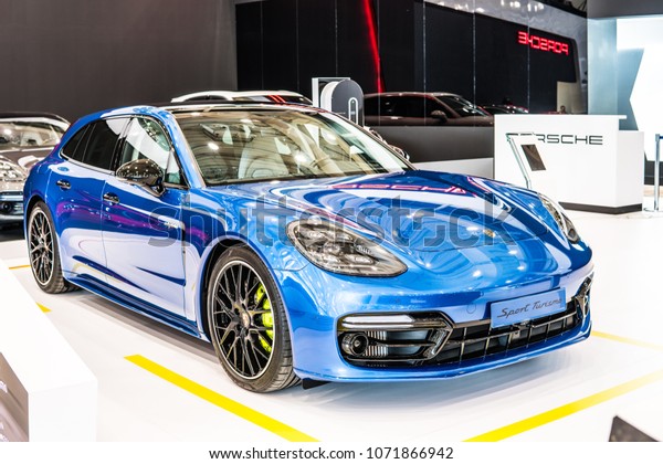 Poznan,\
Poland, April 05, 2018: metallic blue Porsche Panamera 4 E-Hybrid\
Sport Turismo at Poznan International Motor Show, luxury four-door\
sedan produced by German car manufacturer\
Porsche