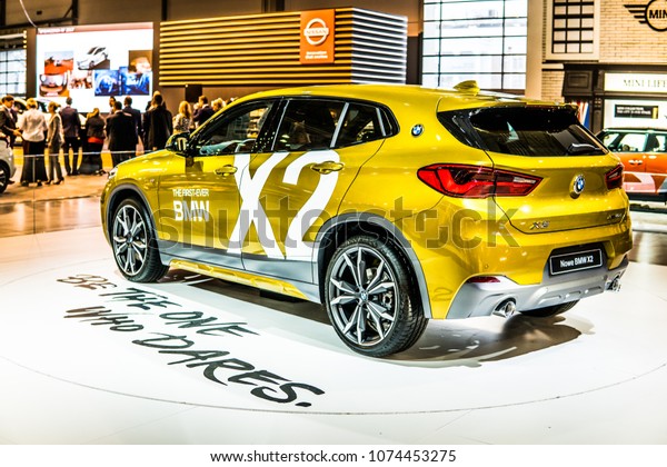 Poznan, Poland, April 05, 2018: metallic\
gold BMW X2 at Poznan International Motor Show, manufactured and\
marketed by BMW Be The One Who\
Dares