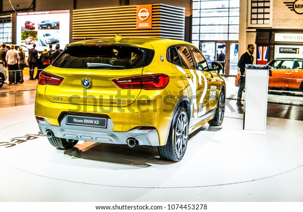 Poznan, Poland, April 05, 2018: metallic\
gold BMW X2 at Poznan International Motor Show, manufactured and\
marketed by BMW Be The One Who\
Dares