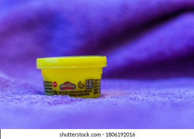 POZNAN, POLAND - Aug 30, 2020: Play Doh Clay In A Yellow Container In Soft Focus Background.