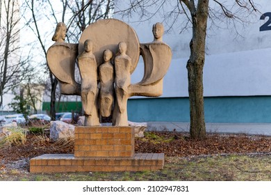 POZNAN, POLAND - Dec 04, 2021: A Sculpture Of A Family With Three Kids In The Polan District