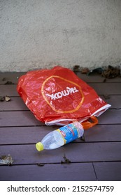 POZNAN, POLAND - Feb 23, 2022: A TK Maxx Shopping Bag And Plastic Milk Bottle On A Floor