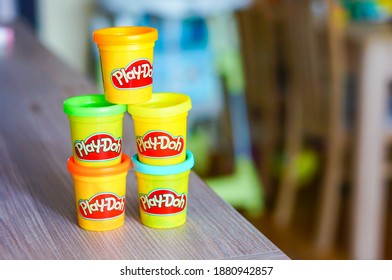 POZNAN, POLAND - Mar 08, 2016: Mix Of Colorful Play Doh Clay In Containers On A Table