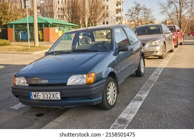 POZNAN, POLAND - Mar 09, 2022: A Parked Old Ford Fiesta Car On A Sidewalk In The Polan District