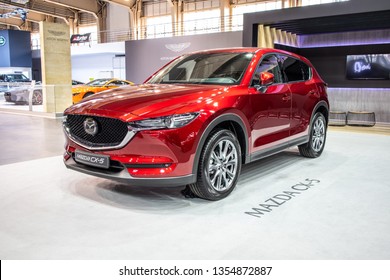 Poznan, Poland, March 28, 2019: metallic red Mazda All-new CX-5 AWD at Poznan International Motor Show, crossover SUV manufactured in Japan by Mazda