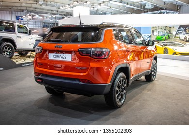 Poznan, Poland, March 28, 2019: metallic orange Jeep Compass 4x4 Trail Hawk compact crossover SUV at Poznan International Motor Show, Jeep is brand of American automobiles