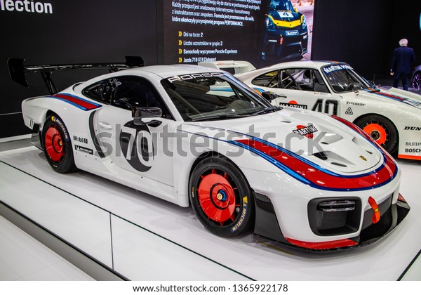 Poznan, Poland, March 28,\
2019: Porsche 935 racing bolid at Poznan International Motor Show,\
Porsche 935/19 race car with Martini, Mobil1, Michelin\
advertisement