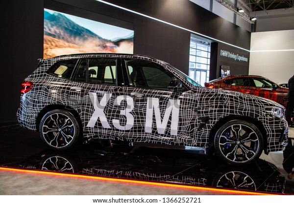 Poznan, Poland, March 28, 2019: BMW X3 M Competition\
with camouflage at Poznan International Motor Show, Third\
generation, G01, compact luxury crossover SUV manufactured by\
German automaker BMW 