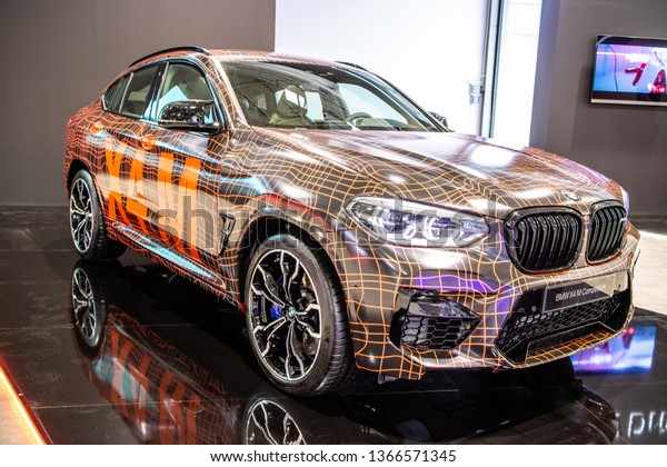 Poznan, Poland, March 28, 2019: BMW X4 M Competition\
with camouflage at Poznan International Motor Show, Second\
generation, G02, compact luxury crossover SUV manufactured by\
German automaker BMW 