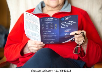 Poznan, Poland- March 3,2022: Illustrative Editorial Of A Unidentified Senior Woman Reading 