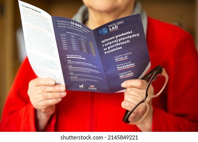 Poznan, Poland- March 3,2022: Illustrative Editorial Of A Unidentified Senior Woman Reading 