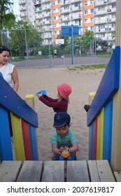 POZNAN, POLAND - May 09, 2016: Little Kids Playing On Wooden Colorful Equipment At A Playground In The Stare Zegrze District, Poznan, Polan