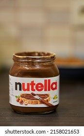 POZNAN, POLAND - May 19, 2022: A Vertical Shot Of An Open Ferrero Nutella Jar With Hazelnut And Chocolate Paste On A Table