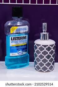 POZNAN, POLAND - Oct 27, 2018: A Vertical Sot Of Listerine Brand Mouth Wash Liquid And A Soap Bottle In A Bathroom