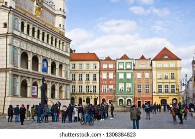 Poznan/Poland - February 6th 2019: Crowd Of Tourists Admiring Old Town Square, Taking Photos Of The Little Goats (koziolki) High Up The Cathedral Building