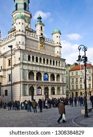 Poznan/Poland - February 6th 2019: Crowd Of Tourists Admiring Old Town Square, Taking Photos Of The Little Goats (koziolki) High Up The Cathedral Building