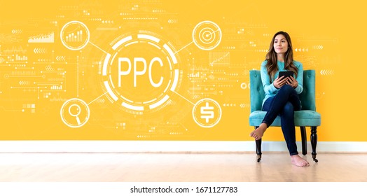 PPC - Pay per click concept with young woman holding a tablet computer