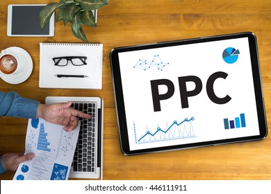PPC - Pay Per Click concept Businessman working at office desk and using computer and objects, coffee, top view,