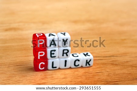 PPC Pay Per Click text on  dices on wooden background