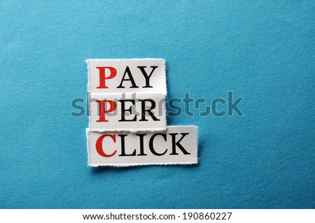 PPC Pay Per Click, words on cut paper hard light