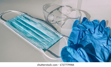 PPE COVID-19 Mask, gloves, protection glasses for healthcare workers. Shortage of personal protective equipment for coronavirus. - Shutterstock ID 1727779984