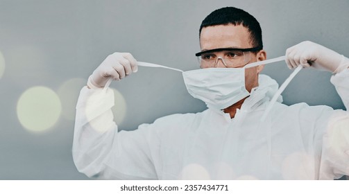 PPE, face mask removal and man in safety suit of lab worker and healthcare professional in a hospital or clinic. Cleaning, bacteria protection for virus, pharmacy and wellness research with bokeh - Powered by Shutterstock