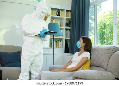 PPE Medical Staff Team Holding Checklist Board For Note With Pen For Check Patient Illness.Visit Home Sick Woman For Isolate And Separate To Another Place.