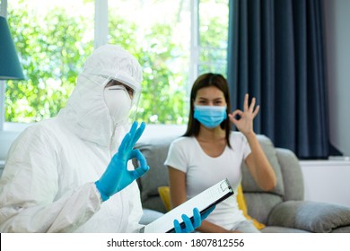 PPE Medical Technical Staff Check Doubt Sick Patient At Home.After Checked Symptom Woman And Result Is Passed.