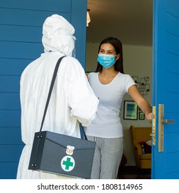 PPE Medical Technical Staff Check Doubt Sick Patient At Home.After Checked Symptom Woman And Result Is Passed.