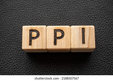PPI - acronym from wooden blocks with letters, abbreviation Producer Price Index, Payment Protection Insurance PPI concept, random letters around - Shutterstock ID 2188507567