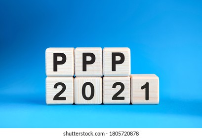 PPP 2021 Years On Wooden Cubes On A Blue Background