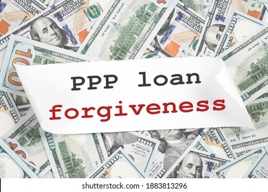 PPP Loan Forgiveness Text Note On Hundred Dollar Bill Notes. Cash Money Background. Small Business Paycheck Protection Program. Banking And Finance Concept