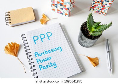 PPP Purchasing Power Parity Written In Notebook On White Table