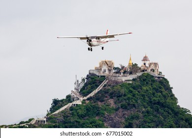 Pra chuab kiri kun Thailand 25 jun 2017 : Training Aircraft Cessna C-172 was descending pass the temple on the Chong kra Jok mountain which the landmark of this province.