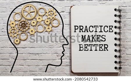 Practice Makes Better text written on a notebook with pencils.