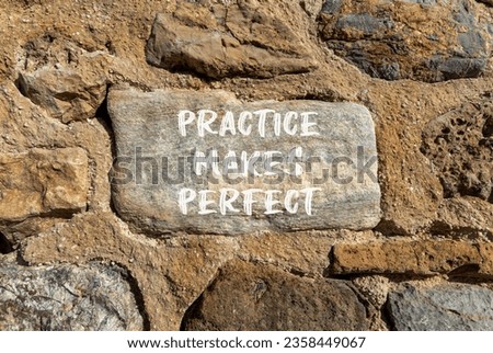 Practice makes perfect symbol. Concept words Practice makes perfect on beautiful big stone on stone wall. Beautiful stone wall background. Business practice makes perfect concept. Copy space.