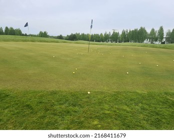 Practice Putting Green With Balls Near Hole Concept