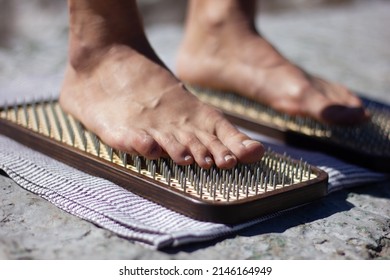 The practice of standing on nails. Close-up of a sadhu wooden board with nails for sadhu practice.