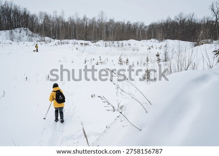 Practicing Synchronized Skiing Techniques. Skiers On Narrow Forest Trail Practicing Together. Skiers Demonstrating Precise Synchronized Movements On Forest Trail With Energetic Teamwork
