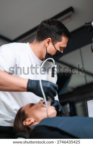 Practitioner Using Portable Scanner To Obtain Precise Dental Impressions For Treatment Planning