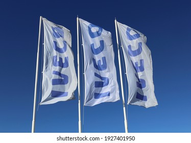 Pradamano, Italy.  February 28,2021. Iveco Banner Flags Outside The Local Dealership. It Is An Italian Transport Vehicle Manufacturing Company 