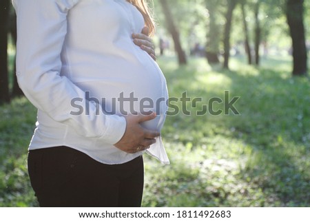 Similar – Foto Bild Schwangere Frau, die ihren Bauch streichelt.