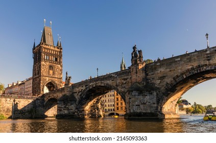 Prague - beautiful old Charles bridge, view from river Vltava, Czech Republic.The oldest bridge in Prague was built on the site of Judith's Bridge. - Shutterstock ID 2145093363