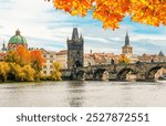 Prague cityscape with Charles bridge over Vltava river in autumn, Czech Republic