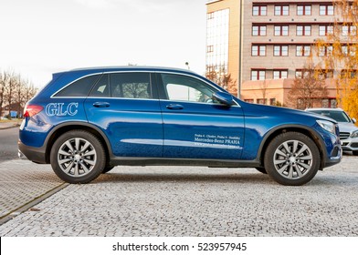 PRAGUE, THE CZECH REP., NOVEMBER 27, 2016: Profile view of luxury car Mercedes-Benz GLC 220d parking in front of car store Daimler.