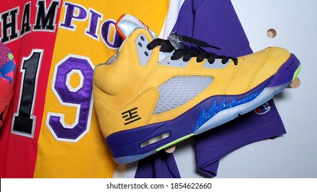 purple and yellow jordans 11