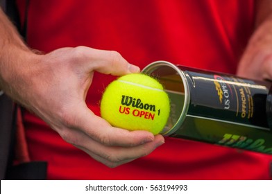 PRAGUE, THE CZECH REPUBLIC, 27.11.2016 - professional tennis player opens new tennis balls Wilson US open. Man holds tenis balls 