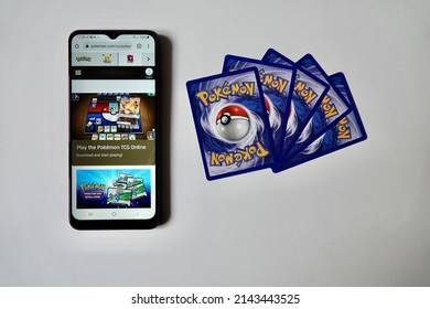 Prague, Czech Republic - April 3 2022:. Back Side Of Pokémon Cards And Smartphone With PTCG. The Pokemon Trading Card Game Is A Collectible Card Game, Based On Nintendo's Pokémon Franchise.