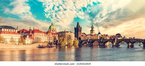 Prague, Czech Republic With Charles Bridge And Vltava River At Sunset Panorama